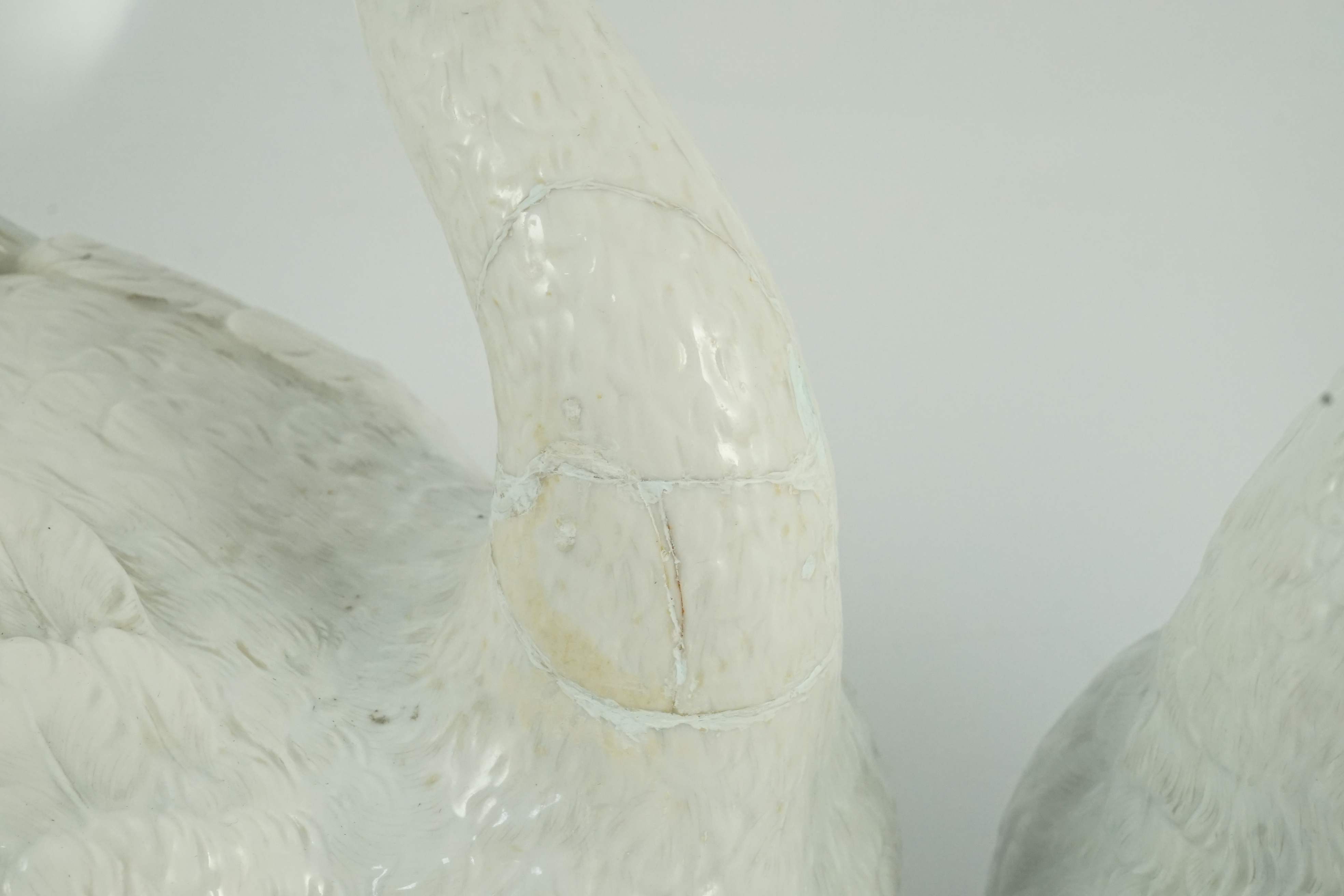 A pair of large Meissen models of swans, 19th century, one neck restored